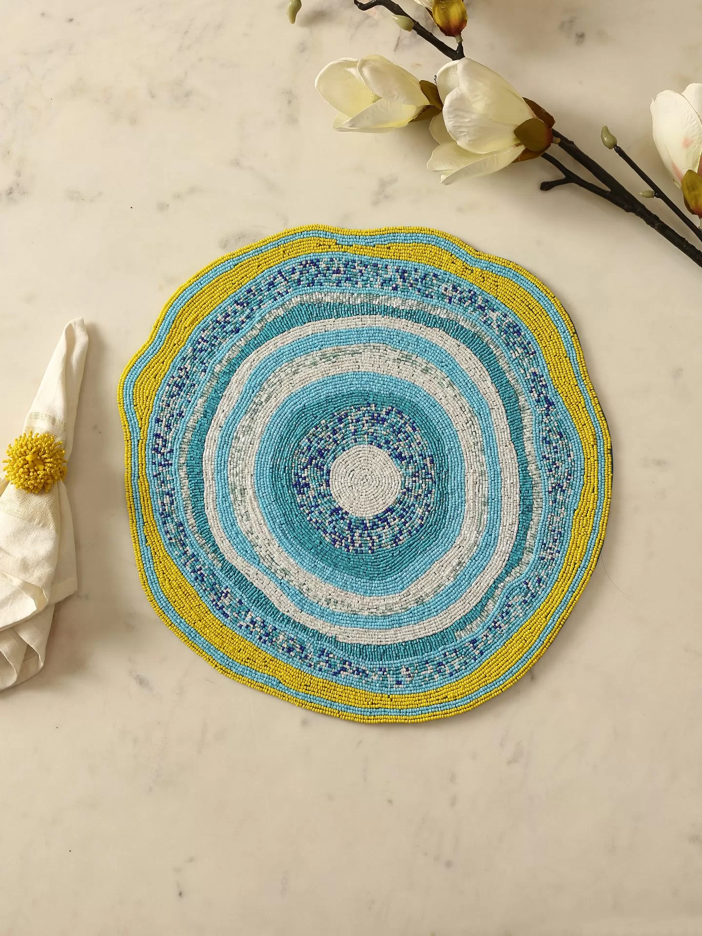 Blue and yellow abstract beaded placemat - Amoliconcepts