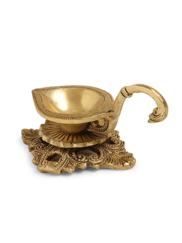 Brass Diya with Handle and intricate base – Amoliconcepts - Amoliconcepts