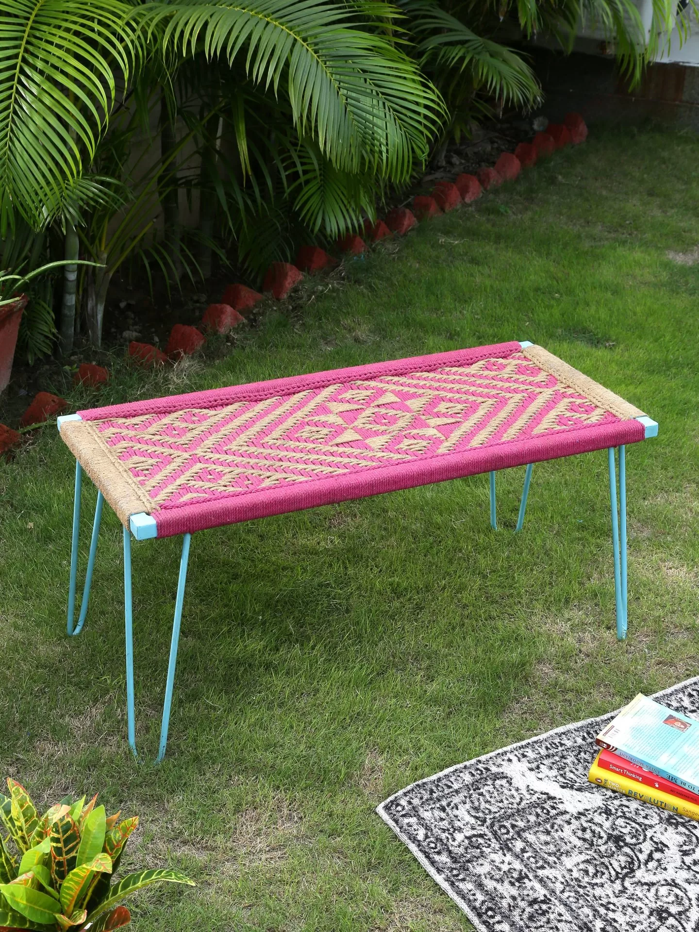 Iron bench with pink & jute weaving